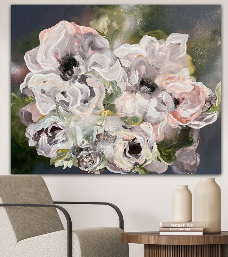 Artist of May A flower painting by the artist of the month. A colorful floral painting hangs on the wall in a living room, enhancing the room's inviting atmosphere.