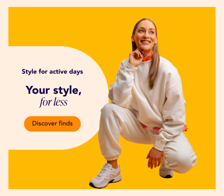 Woman wearing a sweatshirt against an orange background
