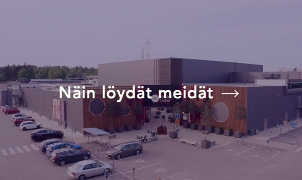 Ostoskylä parkkipaikalta kuvattuna