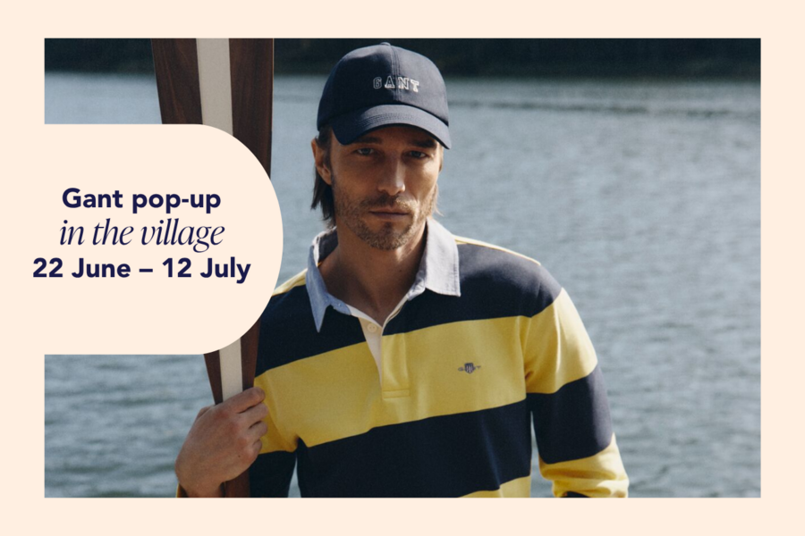 A man wearing Gant cap and stripe shirt