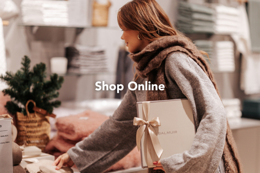 A woman browsing Christmas gifts in the Balmuir store.