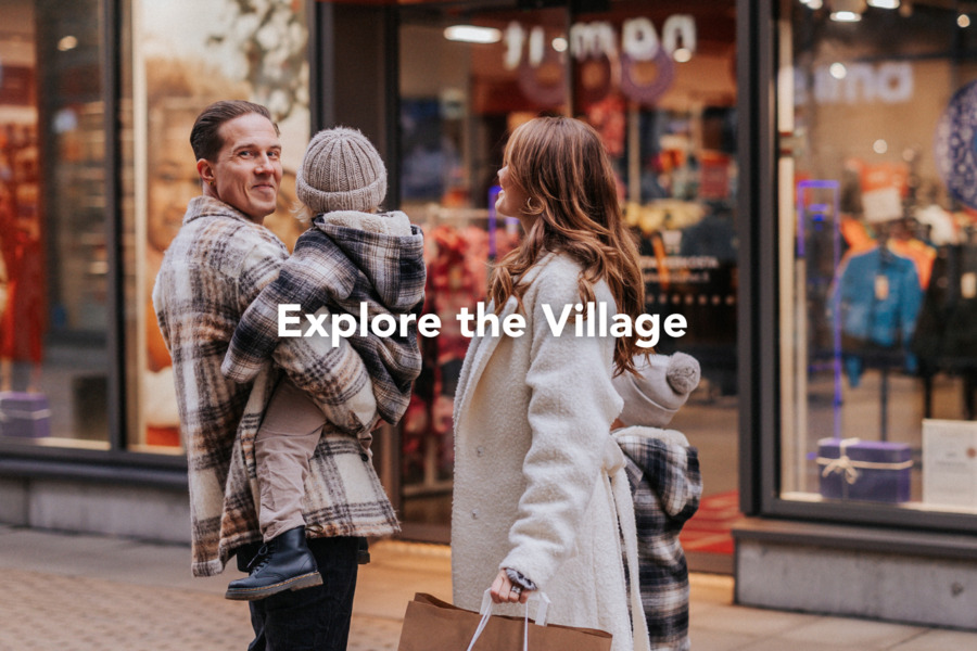 A family with two children shopping in the outlet village