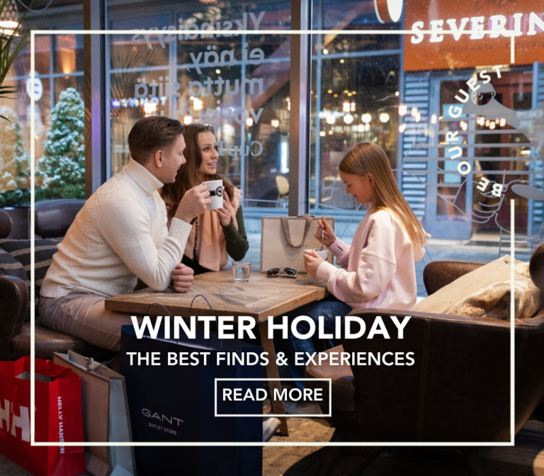 A family taking a break at Espresso House while shopping at the outlet