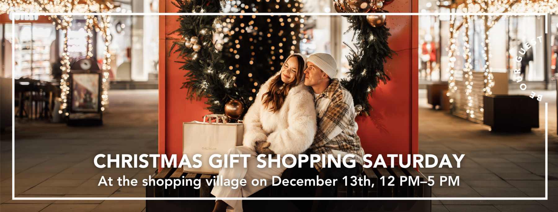 A couple visiting Helsinki Outlet on a late winter night, with Christmas lights behind her